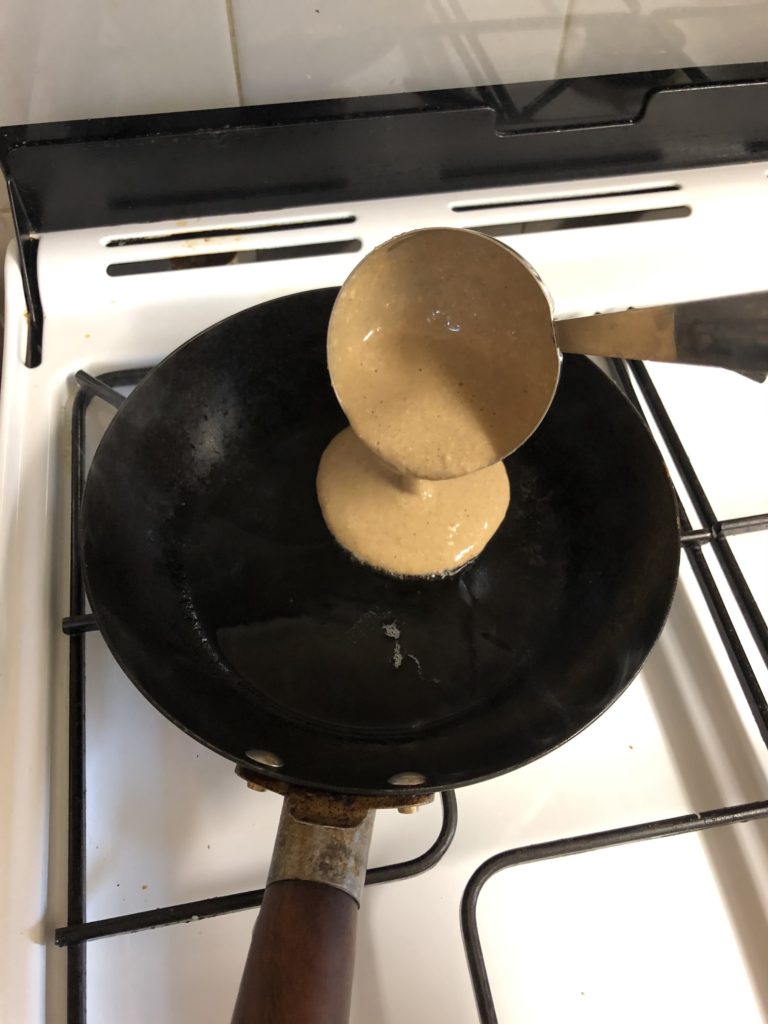 Ladling Pancake Mix into Pan