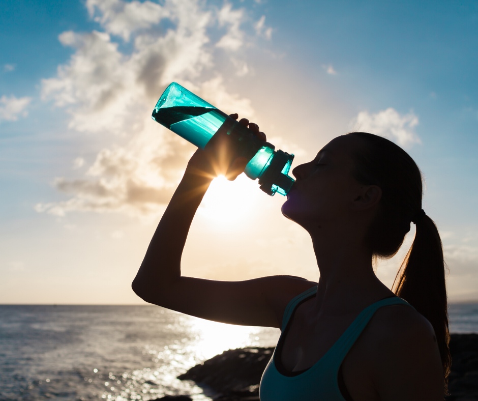 Jogger drinking from plastic bottle